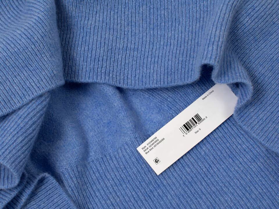 rfid retail store hangtag attached to blue sweater