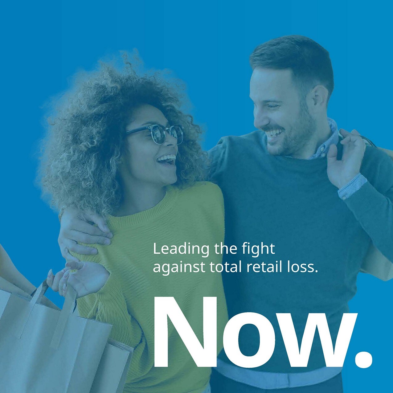 slide 1c now leading the fight against total retail loss over a blue background with young couple carrying shopping bags