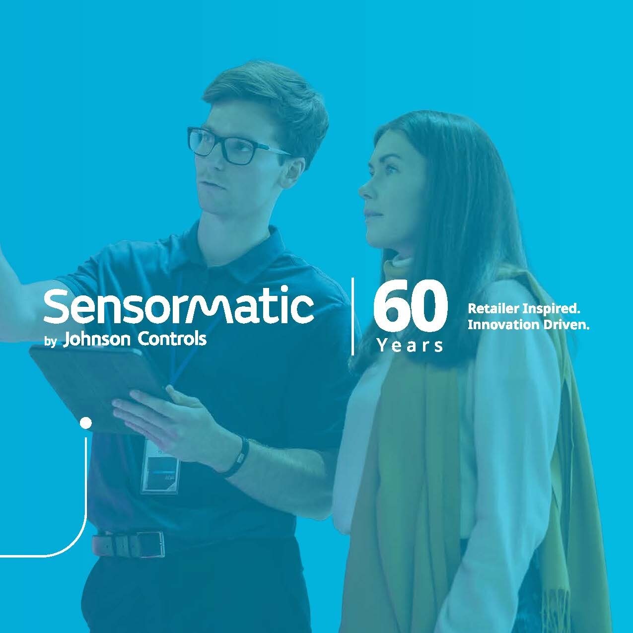 slide 1f male store associate holding electronic device speaking with female shopper with sensormatic logo and 6oth anniversary endorsement retailer inspired innovation driven on blue background