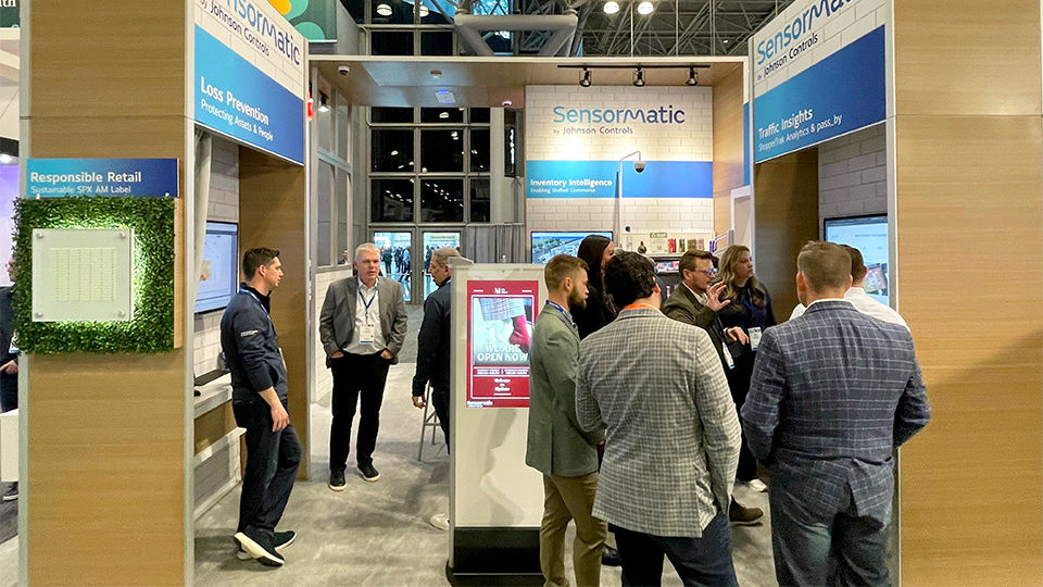attendees at the nrf retail big show 2025 at javits center in nyc visiting the sensormatic solutions booth viewing loss prevention, traffic, and inventory technology