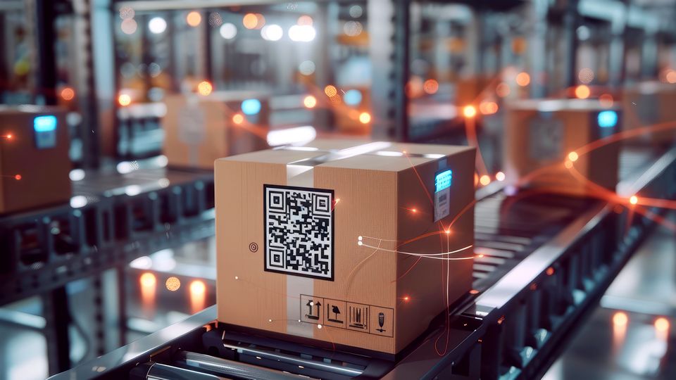a box with a qr code and lit up markings moves on a roller conveyor line in a retail warehouse