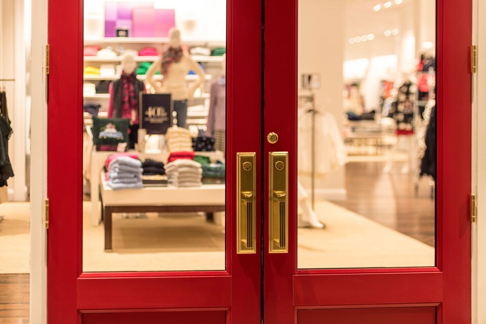 red doors of retail store entrance