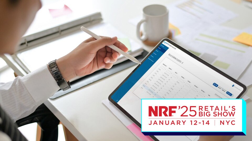 retail manager reviewing loss prevention shrink analyzer report on tablet with nrf 2025 big show logo overlaid