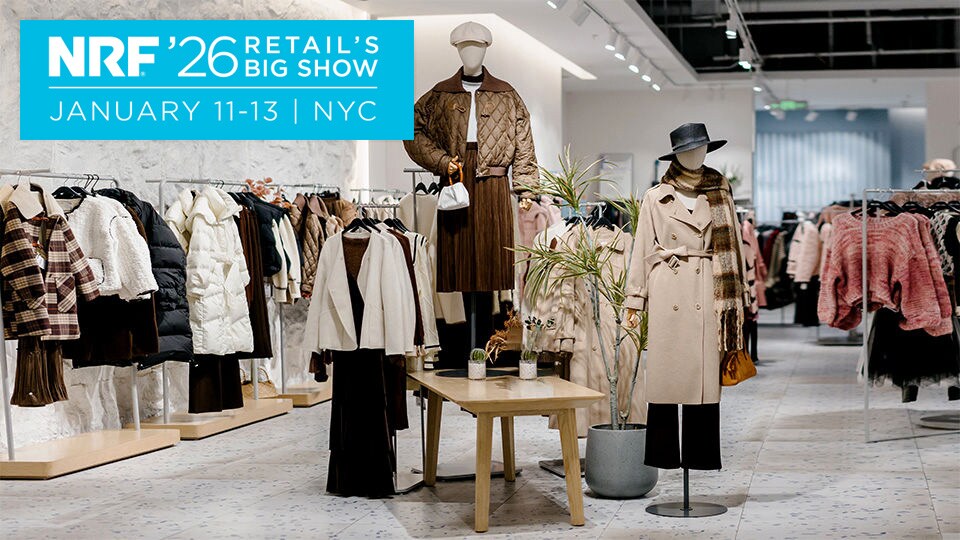 bright upscale retail store interior with racks of apparel and two mannequins at the center with 2026 nrf big show logo superimposed