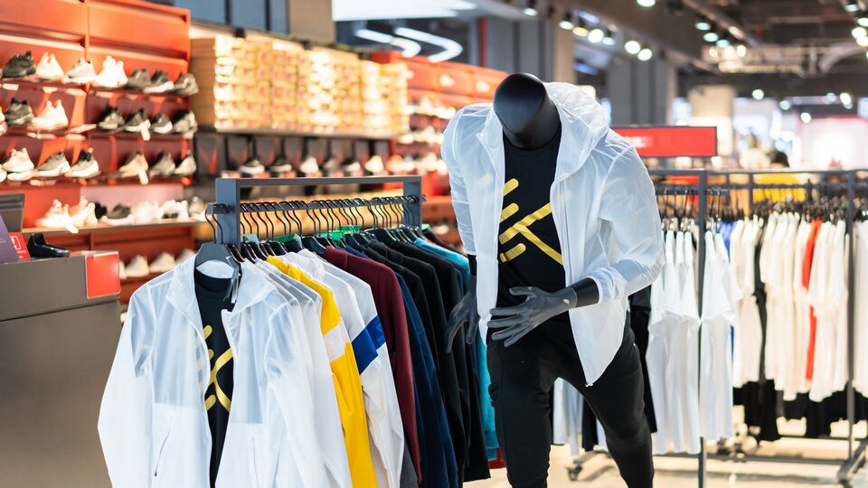mannequin wearing athletic apparel on display in retail sporting goods store