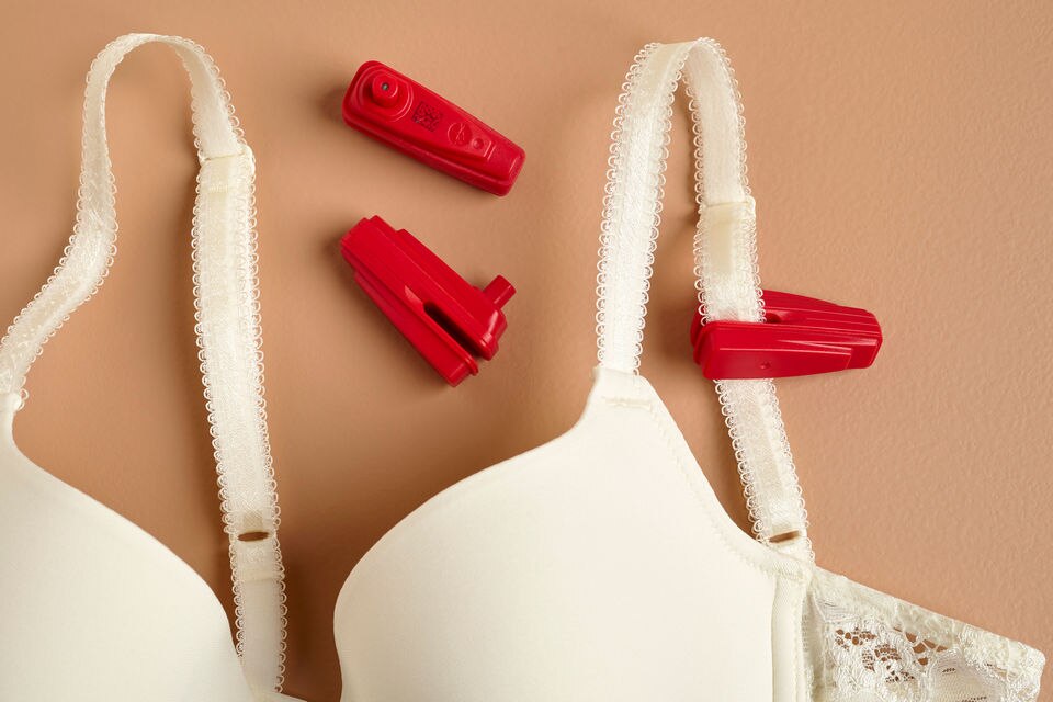 bra with red sensormatic rfid anti-theft tags