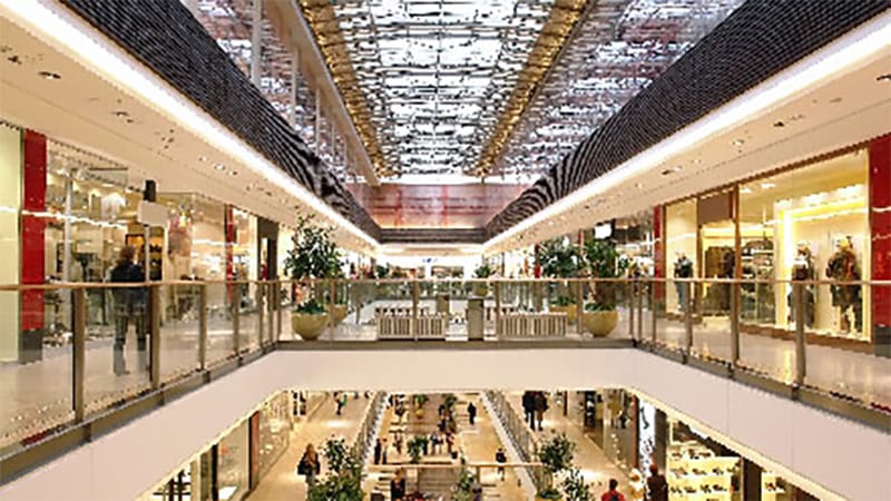 interior view of multi-level retail shopping mall with godiva choclate store