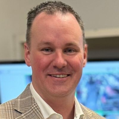 headshot of joe coll of macys at nrf protect 2024 conference 