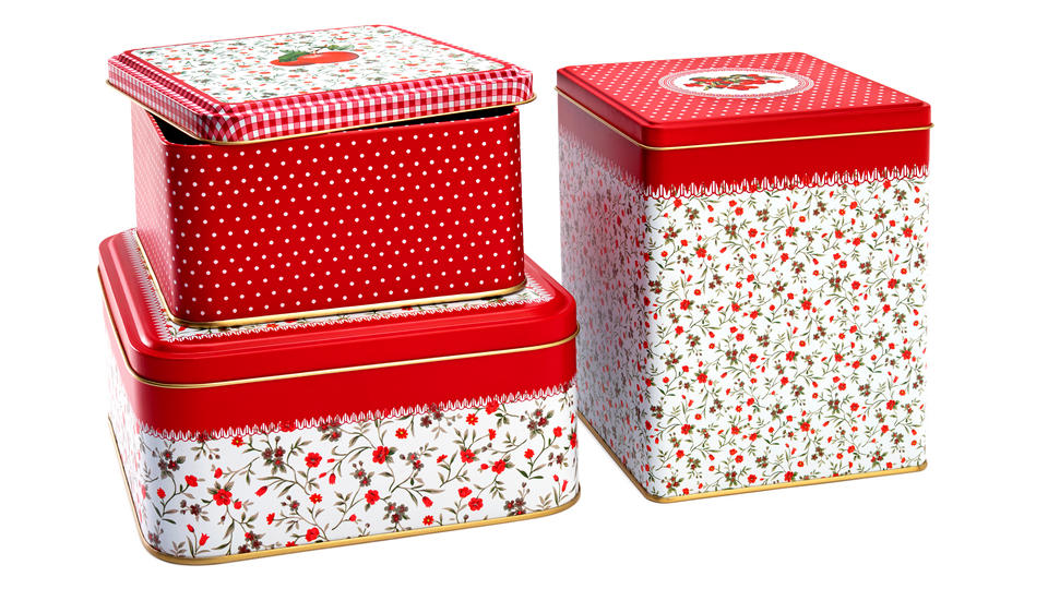 metal gift tins with holiday theme pattersns in red white and green