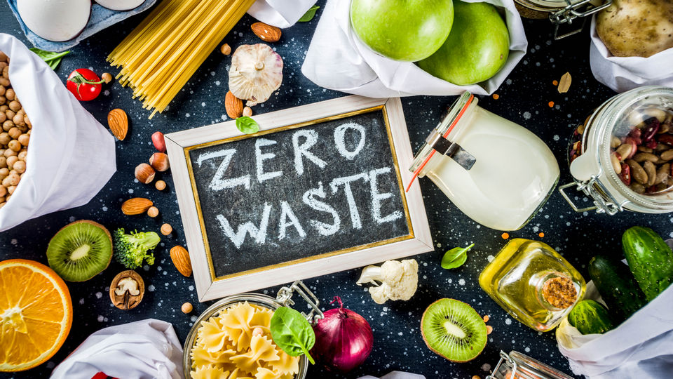 variety of discarded foods with chalkboard sign saying zero waste