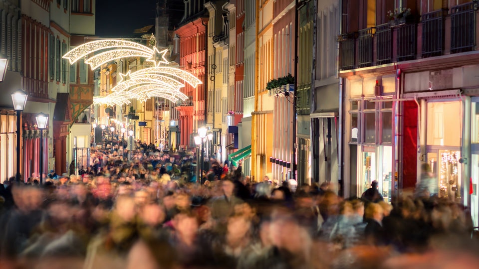 crowded retail shopping street during holiday season