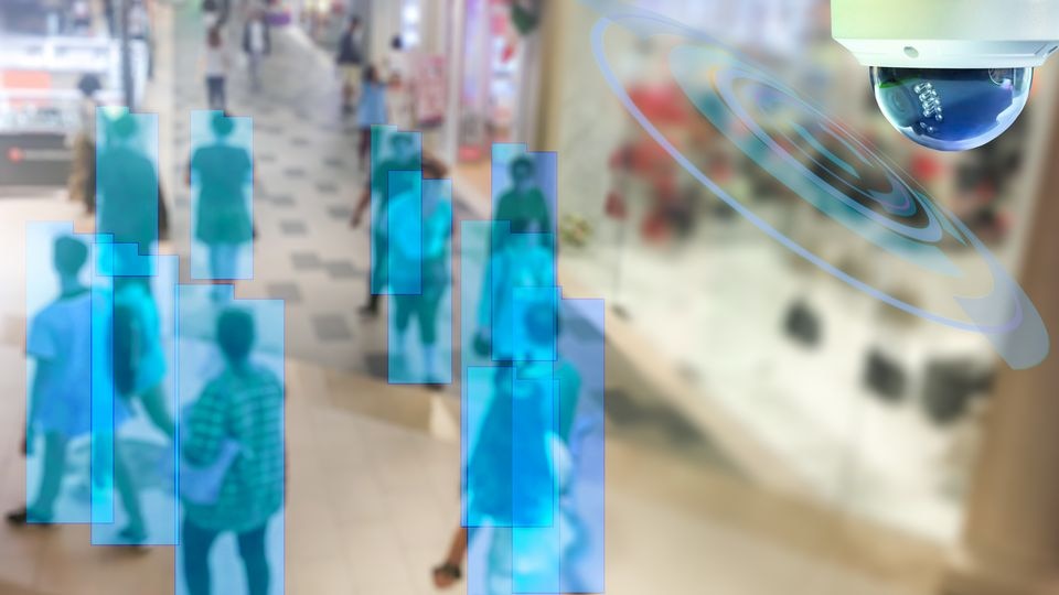 people walking in retail shopping mall identified as shoppers by computer vision surveillance system