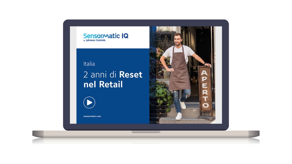 laptop displaying cover of sensormatic retail reset report for italy