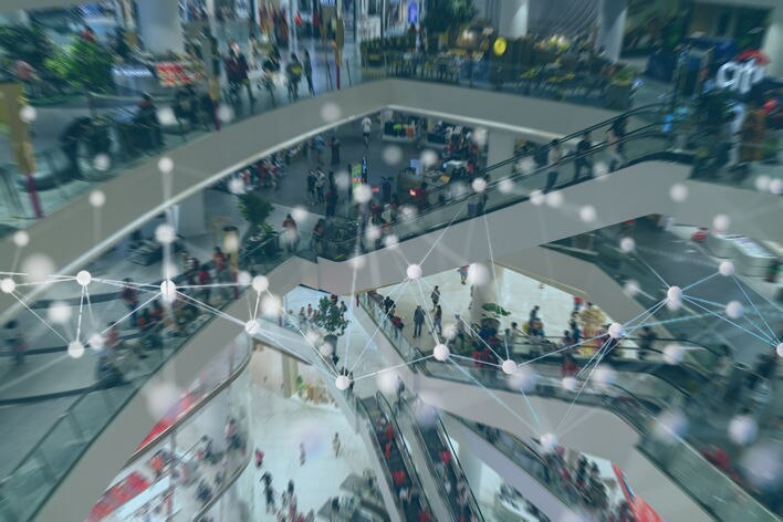 conceptual image of shopping center overlaid with graphic connections