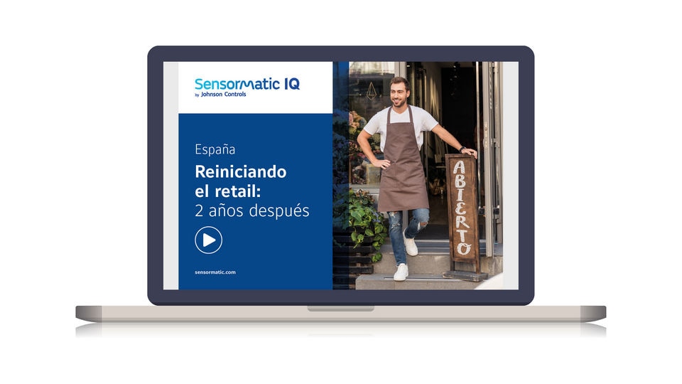 laptop displaying cover of sensormatic retail reset report for spain