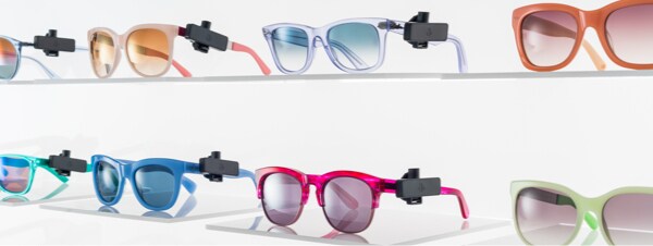 Sunglasses on shelf with Sensormatic anti-theft tags