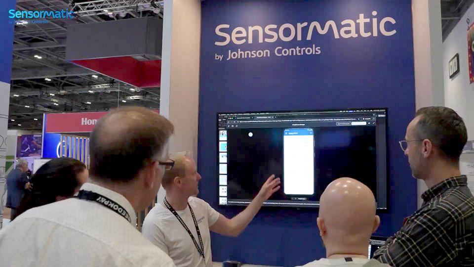 sensormatic compliance smes demonstrating compliance manager mobile software at a tradeshow