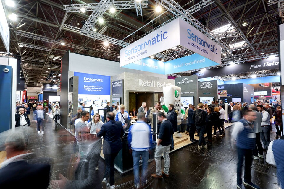 convention attendees and staff at the sensormatic solutions expo booth at eurocis 2025