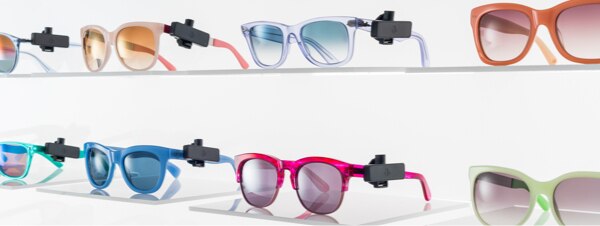 Sunglasses on shelf with Sensormatic anti-theft tags