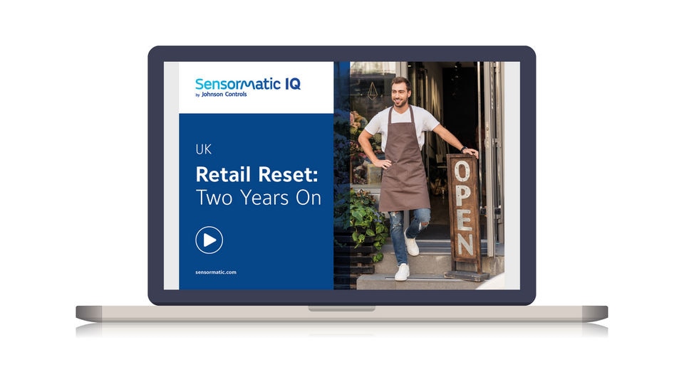 laptop displaying cover of sensormatic retail reset report for uk