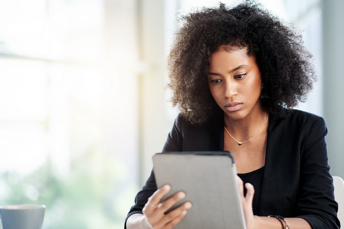 african-american woman using tablet device