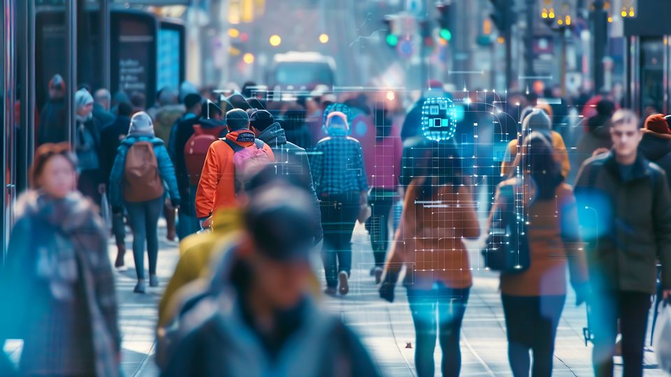 blurred crowd of people on a busy city street wearing cold weather clothing with data grid and information indicators superimposed