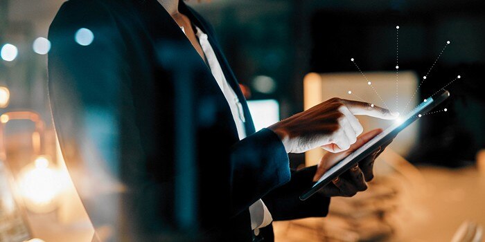 conceptual image of woman tapping on computer tablet