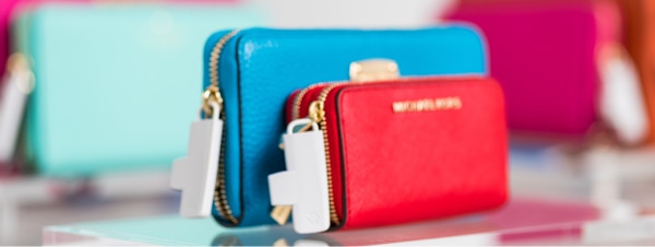 Women's wallets and accoessories with Sensormatic anti-theft tags
