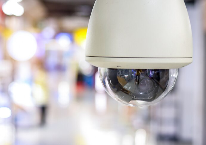 Security camera hanging from ceiling