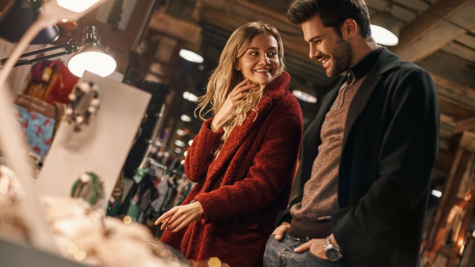 male female couple in retail store shopping for holiday season