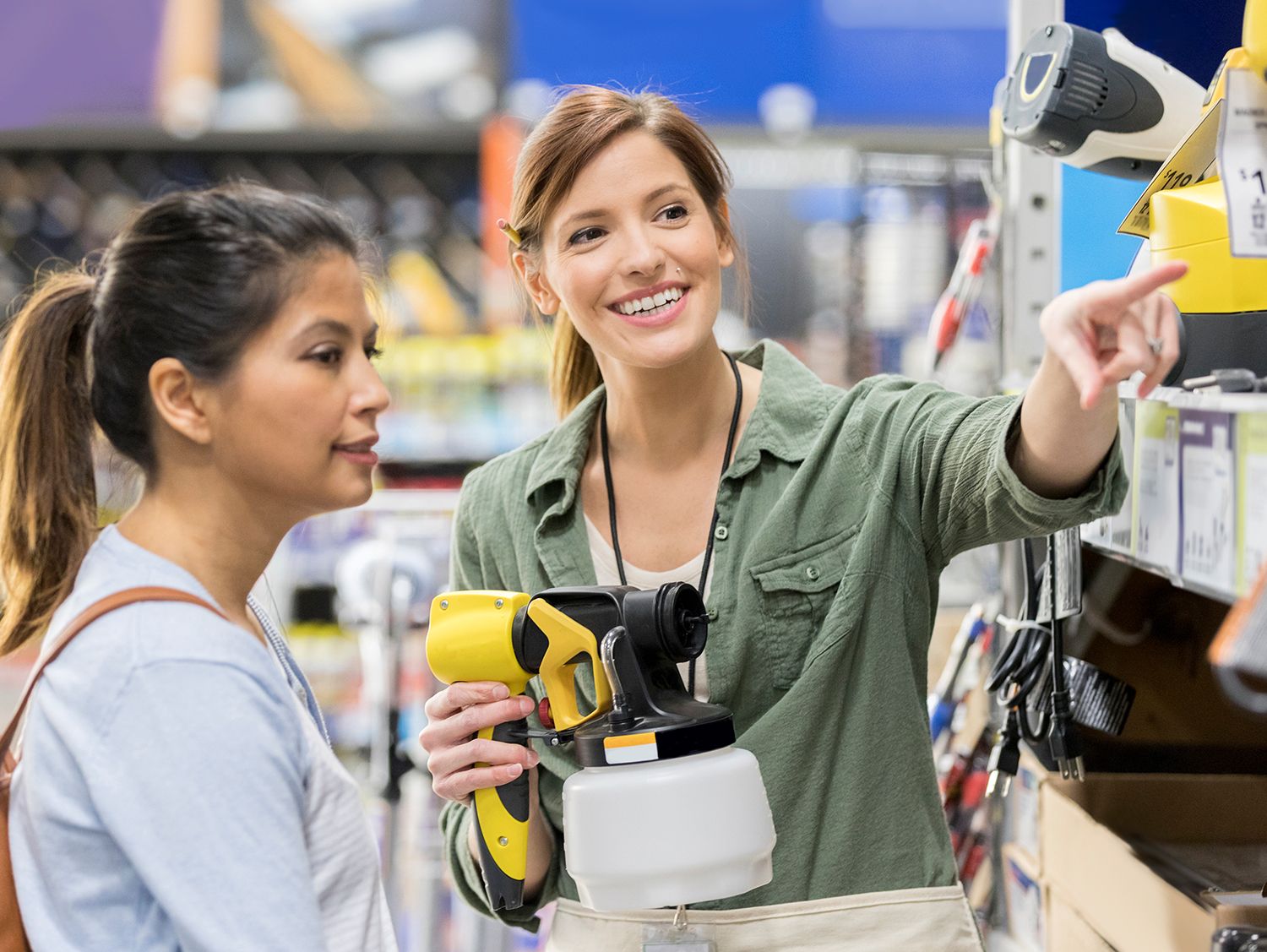 Retail associate helping customer in hardware store
