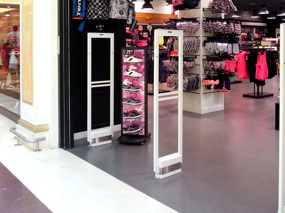 retail apparel store in shopping mall with sensormatic synergy detection pedestals at entrance