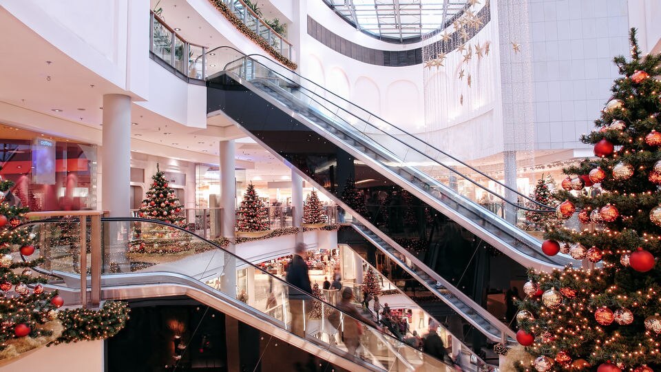 interior retail shopping mall decorated for winter holiday season